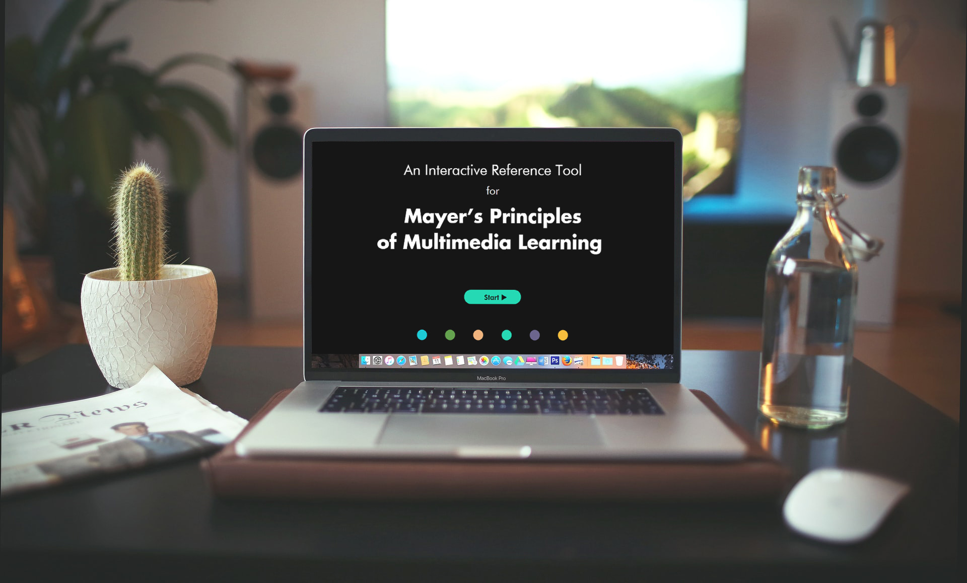 Person using computer with Mayer's principles learning module on screen